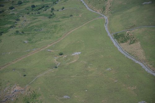 Figure A: View of Erw-wen enclosure, terraced into north-west facing slope. (Image: T. Driver, Crown Copyright RCAHMW, AP-2006_3561)