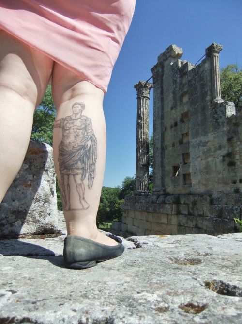 Lady with Roman leg tattoo