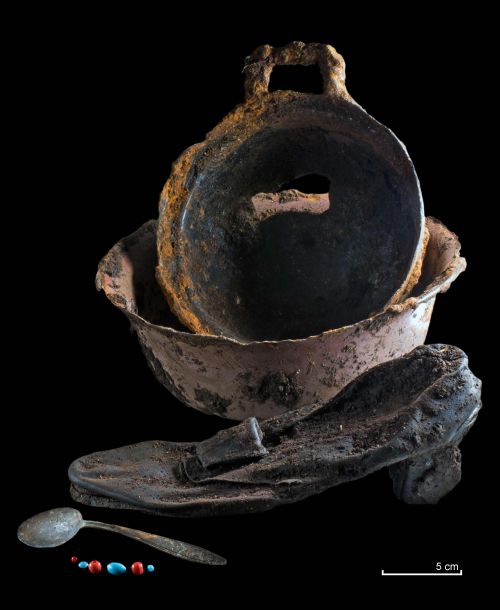 enamelled food dishes, spoon, leather shoe and beads