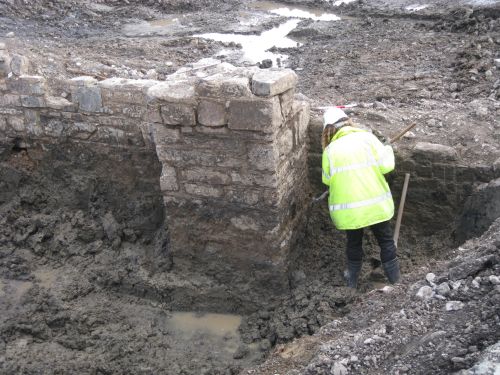 a person working in an archaeological trench