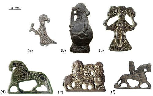 A grid of six 'Valkyrie' pendants/mounts and horse-shaped brooches with a scale bar at the top left showing 10 mm.
(a) A standing human figure, possibly female, with a pointed cap and long dress, holding an object that resembles a cup or horn in one hand.
(b) A standing human figure holding a shield and a spear or staff, with a helmet or elaborate headdress.
(c) A stylized human figure with an elaborate, possibly horned or winged, headdress, and intricate patterns on the body, which tapers downwards.
(d) A horse-shaped brooch with incised lines on its body, standing on four legs.
(e) Two figures on horseback, facing each other, possibly representing warriors, with detailed armor or clothing.
(f) A single rider on horseback, with the horse in a dynamic pose.