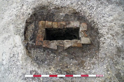 excavated pit surrounded by brick structure