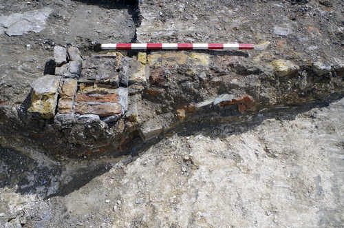 excavated trench showing exposed brickwork