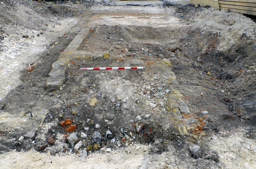 excavated trench showing exposed foundations