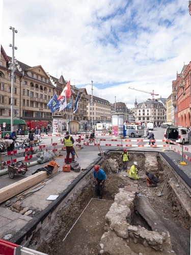 The remains of a row of houses, which had fallen victim to a devastating fire in the 14th century, under excavation in Marktplatz, Basel, Switzerland.