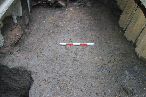Dumped deposit/levelling (1024), looking south-east. 0.1m scale units