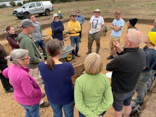 Heritage for Wellbeing project participants at an archaeological excavation at Arminghall Henge, Norfolk